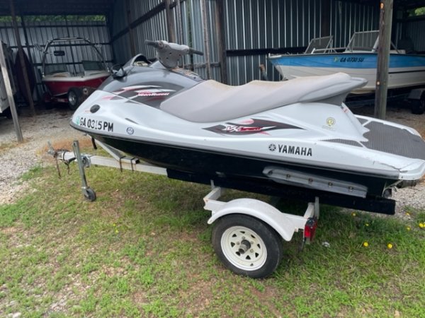 A personal water craft (PWC) is a recreational watercraft that the rider sits or stands on, rather than inside of, as in a boat.  This version accommodates three or more people.