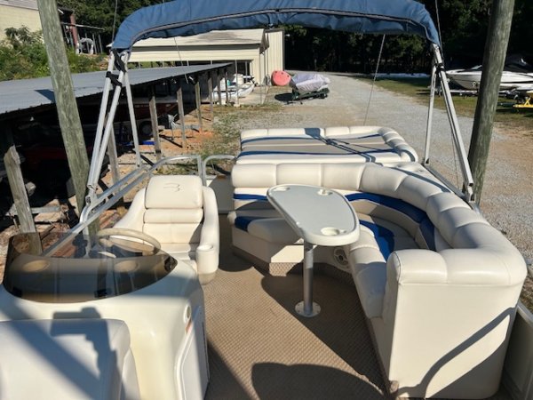 The definition of an outboard motor is a detachable engine mounted on outboard brackets on the stern of your boat.  This configuration will have only one single engine.