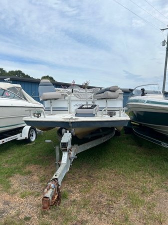 The deckboat is a cross between a bowrider and a pontoon boat.  It features a rather flat deck area with lots of room for people while still offering the speed and agility of a runabout.