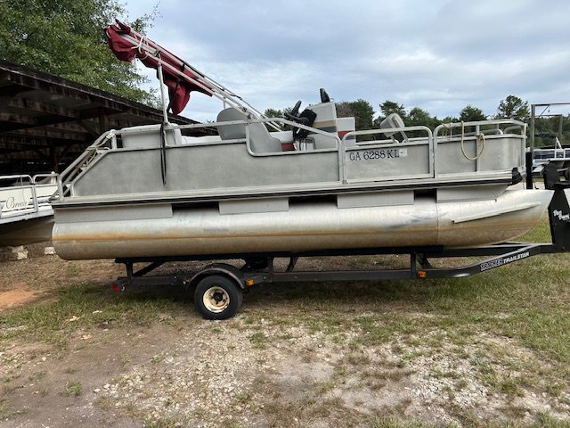 The definition of an outboard motor is a detachable engine mounted on outboard brackets on the stern of your boat.  This configuration will have only one single engine.